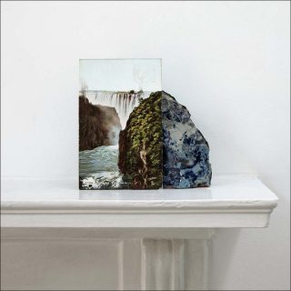 A postcard of Victoria Falls leaning against a geological sample from John Latham’s mantlepiece, Impression C-print, Stuart Whipps