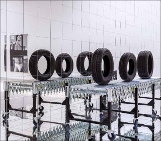 Josephine Meckseper, Sabotage on Auto Assembly Line to Slow it Down, 2009.